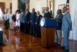 Governor Kenneth Mapp and Lieutenant Governor Osbert Potter stand with the 11 rejected cabinet members at Government House In St. Thomas. Mapp reappointed the members today.