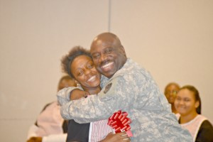 Candy Striper kadia Joseph, being embraced by her father, Derek Joseph at J.F.L.'s 2016 Candy Striper ceremony.