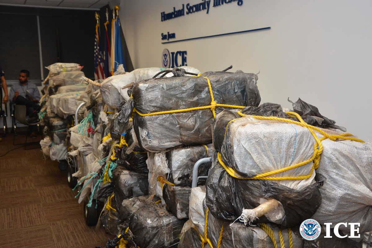 Archival HSI image showing bundles of seized cocaine in San Juan, Puerto Rico. Federal prosecutors say a separate 17-person network used the San Juan airport and U.S. mail to move cocaine to mainland destinations.