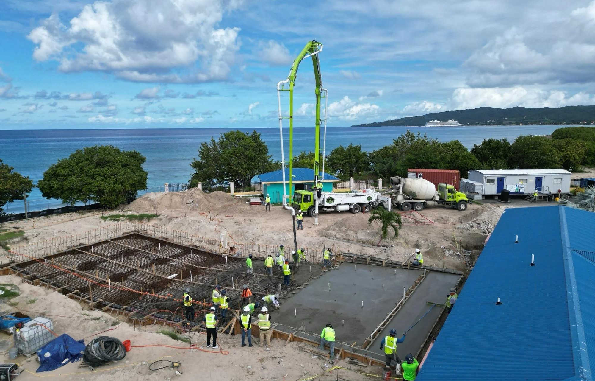 Construction crews work on a seaside development in the U.S. Virgin Islands, illustrating the major building projects local contractors hope to access as lawmakers move to ease bonding barriers.
