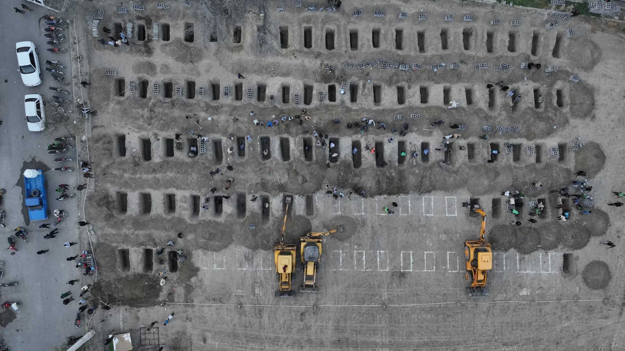Fresh graves are dug for victims after a reported strike on a school in Minab, Iran, on March 2, 2026.
