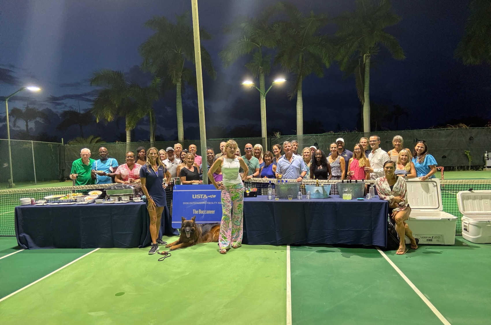 The Buccaneer owner Elizabeth Armstrong, center, joins members of the St. Croix tennis community in celebrating the resort’s 2026 USTA Outstanding Facility Award.