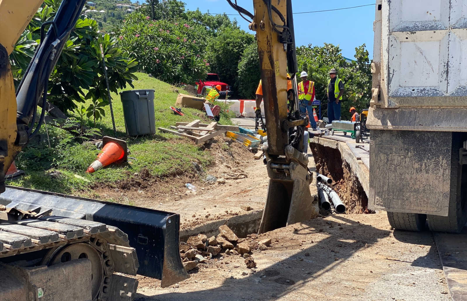 Crews perform roadway and underground utility work in the U.S. Virgin Islands, similar to infrastructure planned under the $767.7 million in initial Rebuild USVI contract authorizations.