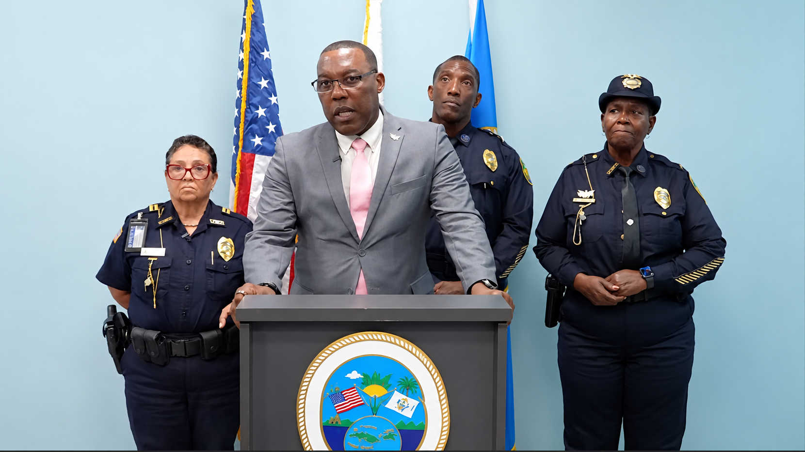 VIPD Commissioner Mario Brooks announces two juvenile arrests in a St. Croix hate-crime investigation, joined by Chief Houston Cornelius behind him, Deputy Chief Naomi Joseph at right and Captain Herminia Rivera at left.